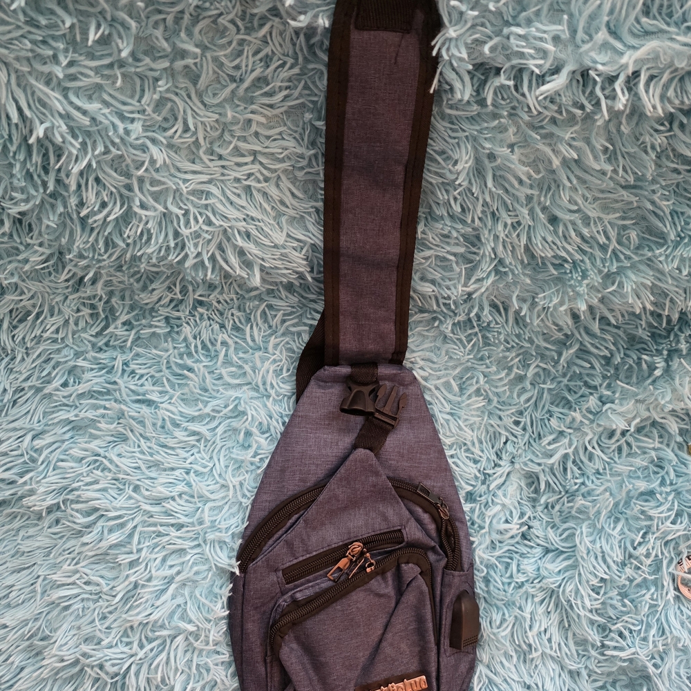 New Unisex Blue Sling Backpack W/ USB Cord
